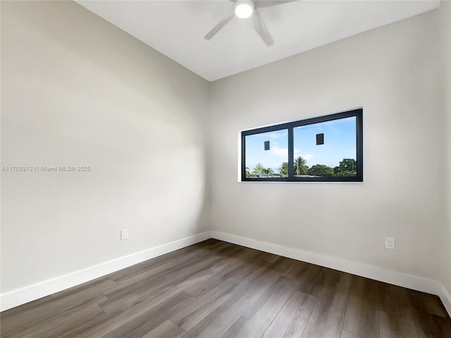 unfurnished room featuring ceiling fan, baseboards, and wood finished floors