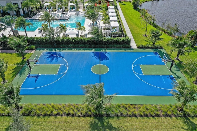 view of basketball court featuring community basketball court and a water view