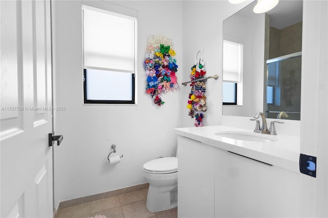 full bathroom featuring tile patterned floors, an enclosed shower, toilet, baseboards, and vanity