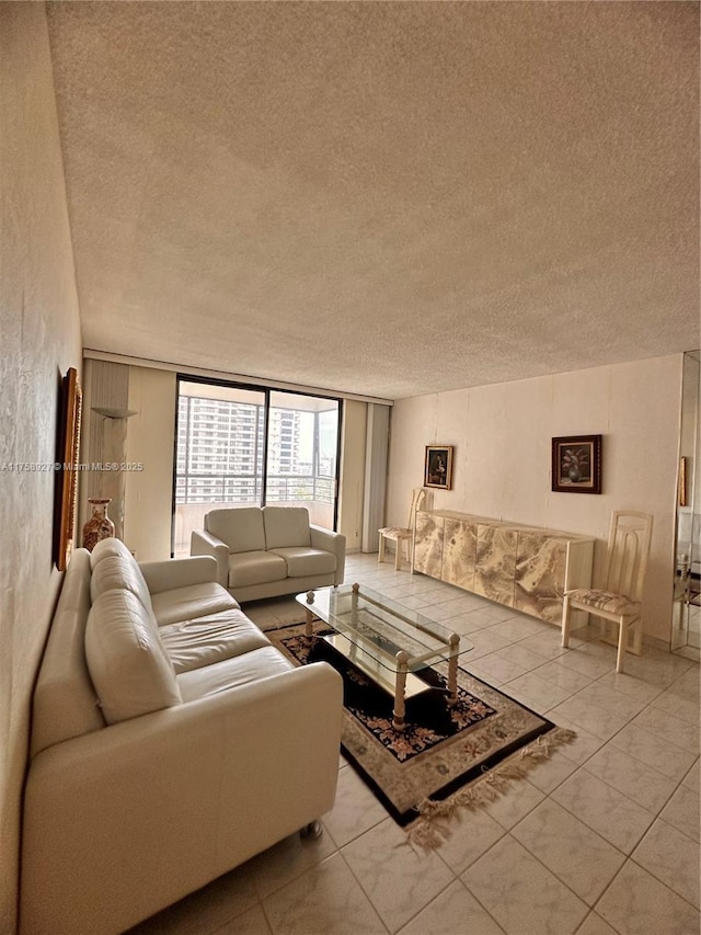 living room with light tile patterned floors and a textured ceiling