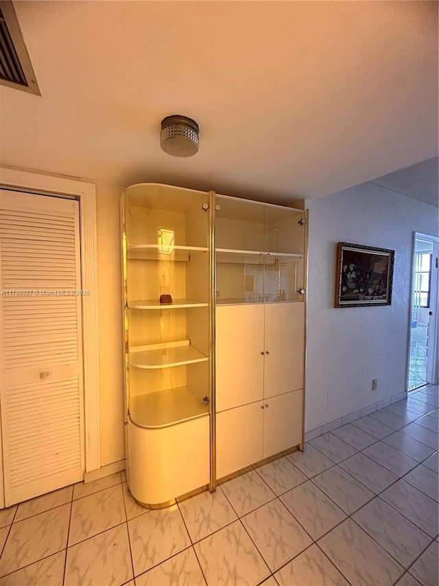 interior space featuring visible vents and baseboards