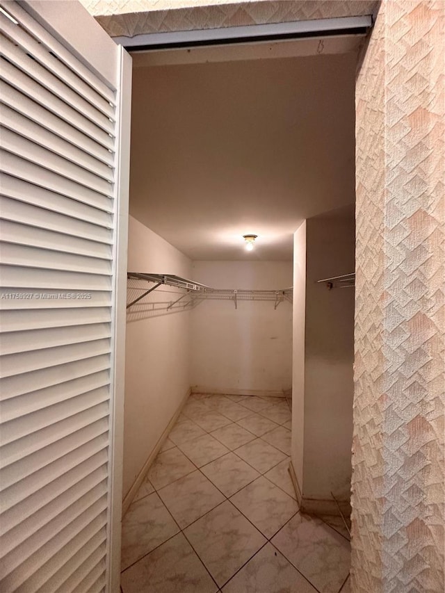 walk in closet featuring tile patterned floors