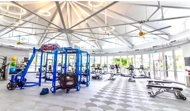 gym featuring visible vents and high vaulted ceiling