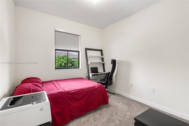 carpeted bedroom with baseboards