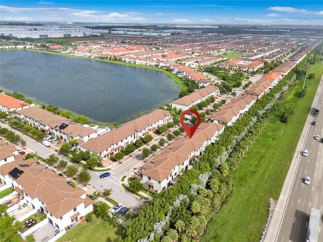 aerial view featuring a water view and a residential view