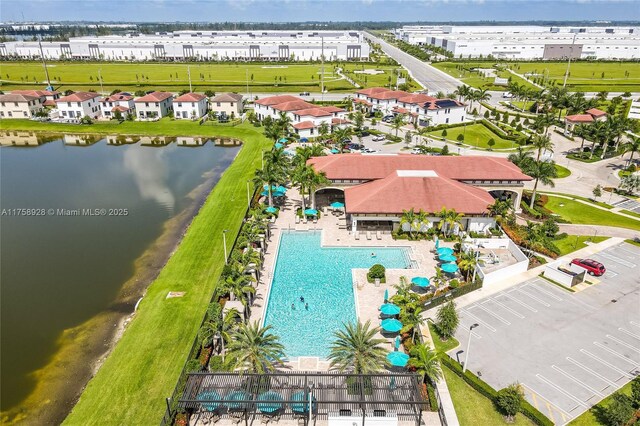 birds eye view of property featuring a water view