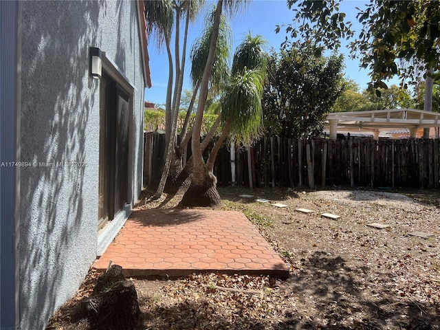 view of yard with a patio area and fence