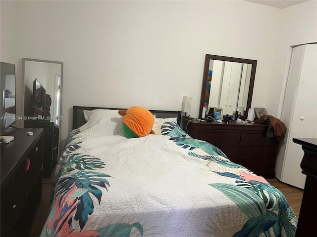 bedroom featuring wood finished floors