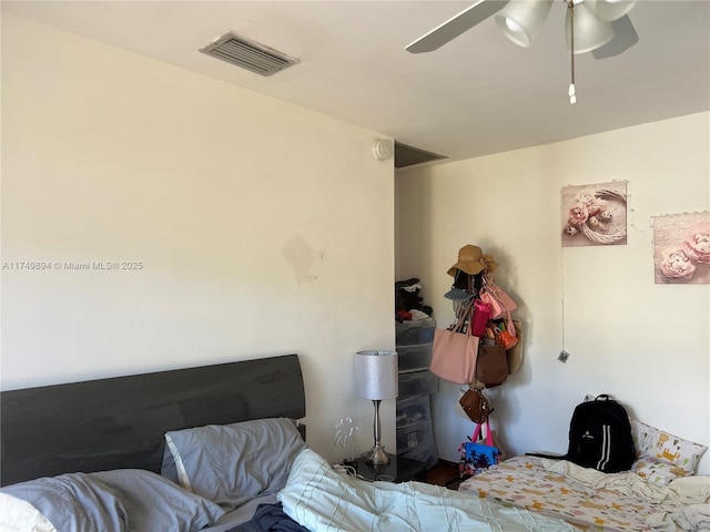 bedroom featuring ceiling fan and visible vents