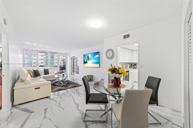 dining room featuring marble finish floor, visible vents, and baseboards