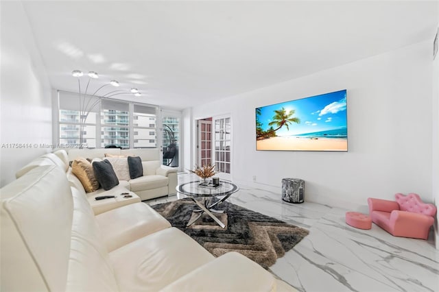 living area featuring marble finish floor