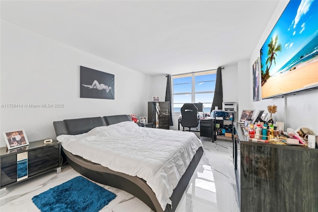 bedroom featuring marble finish floor