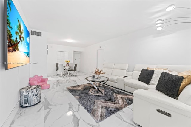 living area with marble finish floor and visible vents