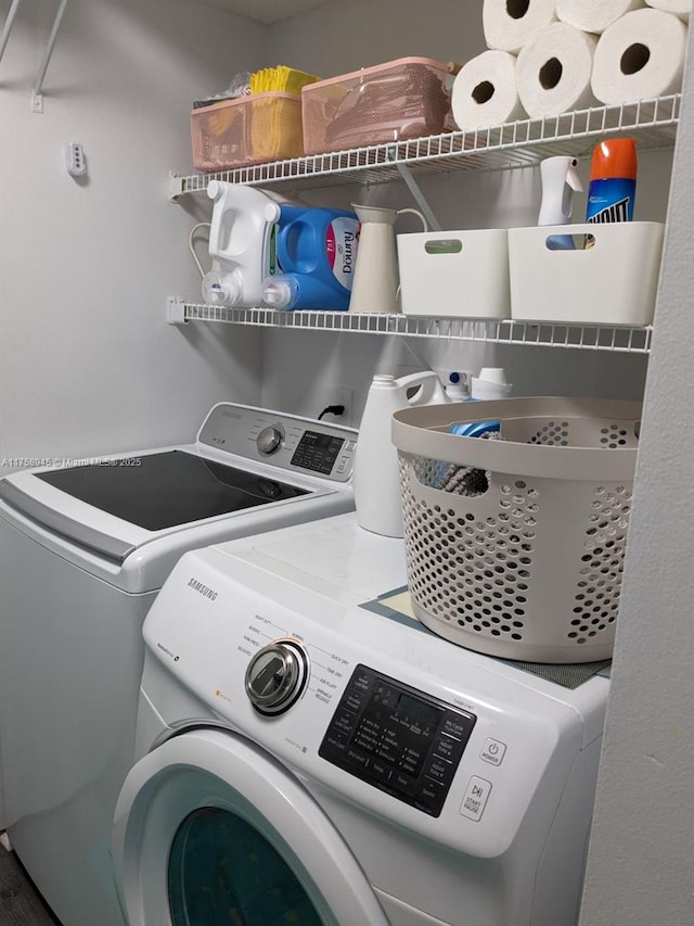 laundry room with washer and dryer and laundry area