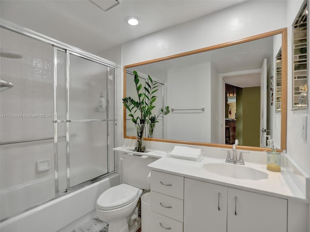 full bathroom with vanity, toilet, recessed lighting, and bath / shower combo with glass door