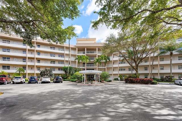 view of property featuring uncovered parking