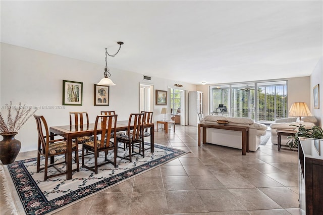 dining room featuring visible vents and tile patterned floors