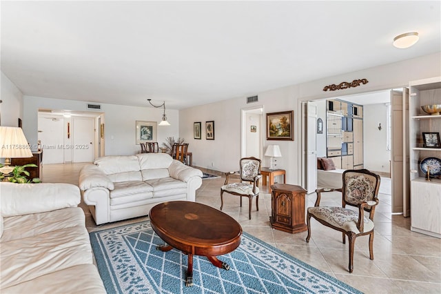 living area featuring visible vents and light tile patterned floors