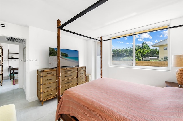 bedroom featuring light tile patterned flooring