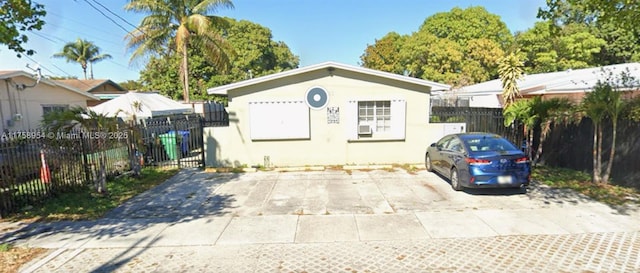 view of outbuilding featuring fence