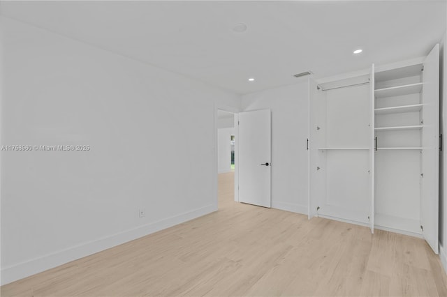 1116 N 31st Ave, Hollywood, FL 33021 - unfurnished bedroom with light wood-style flooring and recessed lighting