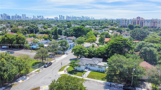 birds eye view of property with a view of city