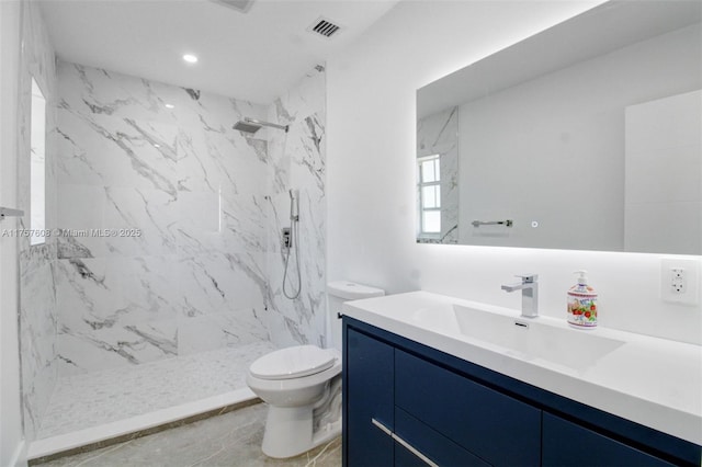 bathroom featuring a marble finish shower, visible vents, toilet, vanity, and recessed lighting