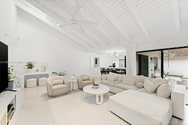 living area with high vaulted ceiling, tile patterned flooring, beamed ceiling, and ceiling fan with notable chandelier