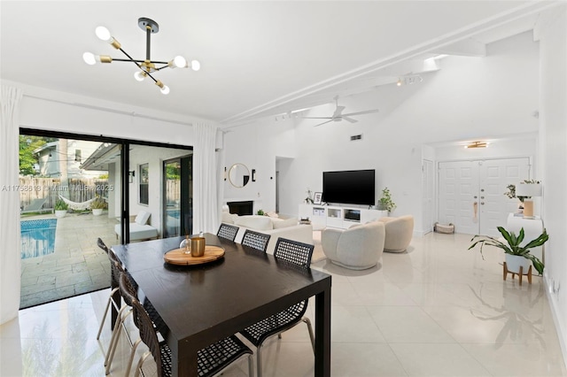 dining area featuring ceiling fan with notable chandelier and visible vents