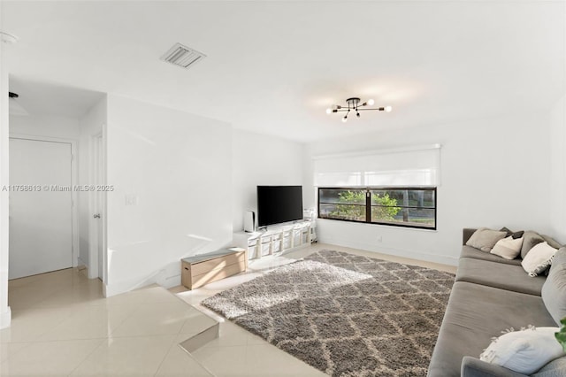 living area with tile patterned flooring and visible vents