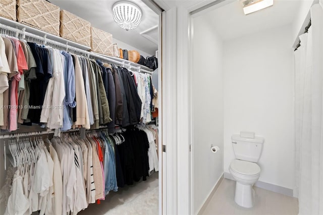 spacious closet with tile patterned flooring