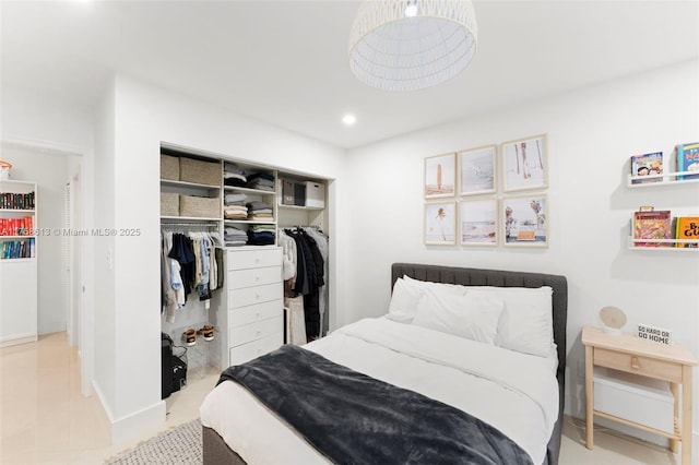 bedroom featuring recessed lighting, a closet, and tile patterned floors