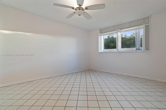 330 NE 26th Ave Unit 4160, Boynton Beach, FL 33435 - spare room featuring a textured ceiling and ceiling fan