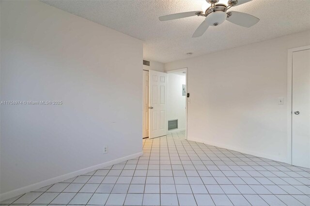 330 NE 26th Ave Unit 4160, Boynton Beach, FL 33435 - empty room with a textured ceiling and ceiling fan