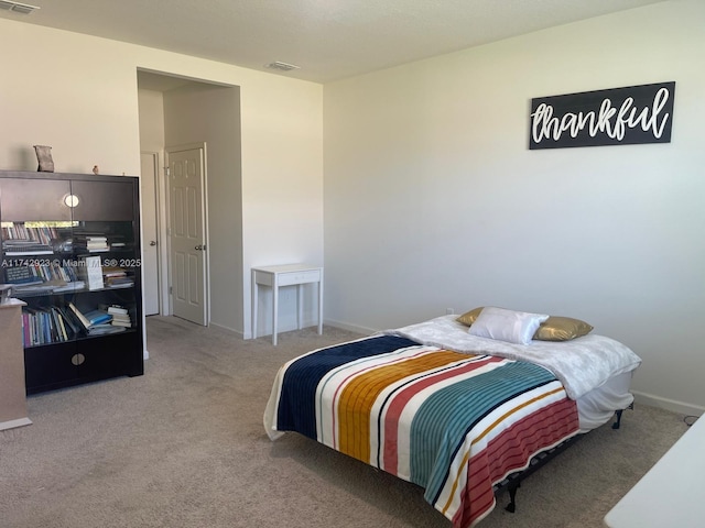 bedroom with visible vents, baseboards, and carpet flooring