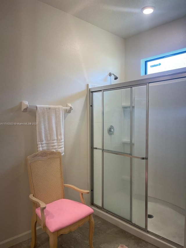 bathroom with a shower stall