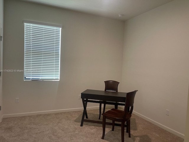 home office featuring carpet flooring and baseboards