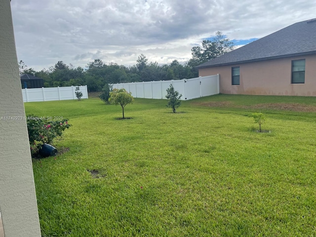 view of yard with fence