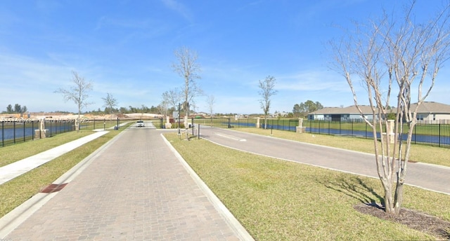 view of road with a gated entry