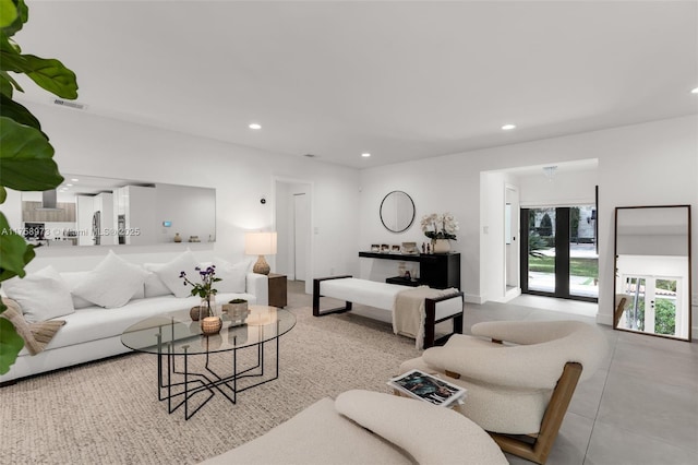 living area with recessed lighting and visible vents