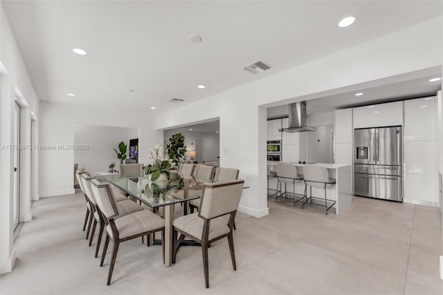 dining room featuring recessed lighting, visible vents, and baseboards