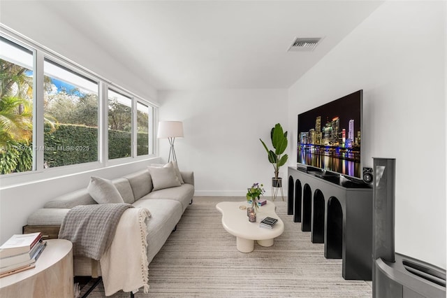 living room featuring visible vents and baseboards