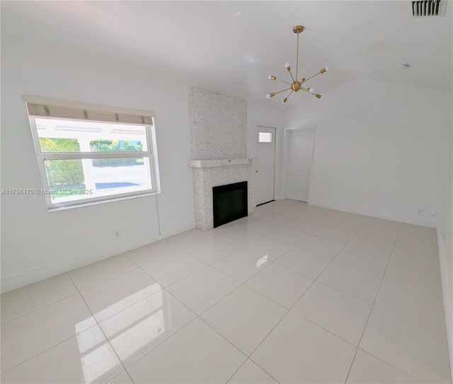 755 NE 88th St, Miami, FL 33138 - unfurnished living room with light tile patterned floors, visible vents, vaulted ceiling, a notable chandelier, and a large fireplace