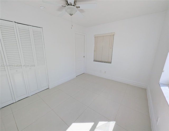 755 NE 88th St, Miami, FL 33138 - unfurnished bedroom featuring baseboards, light tile patterned flooring, and a ceiling fan