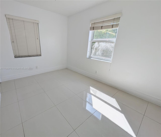 755 NE 88th St, Miami, FL 33138 - tiled spare room featuring baseboards