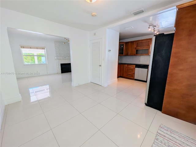 755 NE 88th St, Miami, FL 33138 - interior space with brown cabinetry, visible vents, appliances with stainless steel finishes, and light tile patterned floors