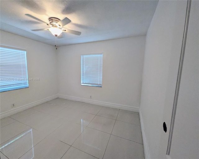 755 NE 88th St, Miami, FL 33138 - unfurnished room featuring light tile patterned floors, baseboards, and a ceiling fan