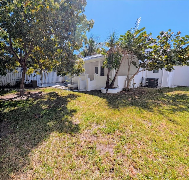 755 NE 88th St, Miami, FL 33138 - view of yard with central AC unit and fence