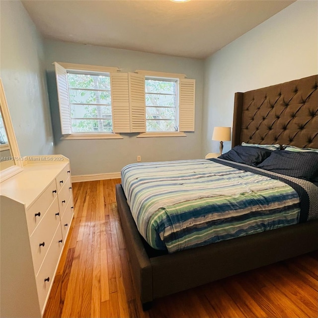 bedroom featuring light wood-style floors