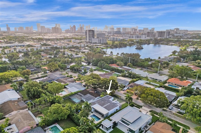 aerial view with a city view and a water view